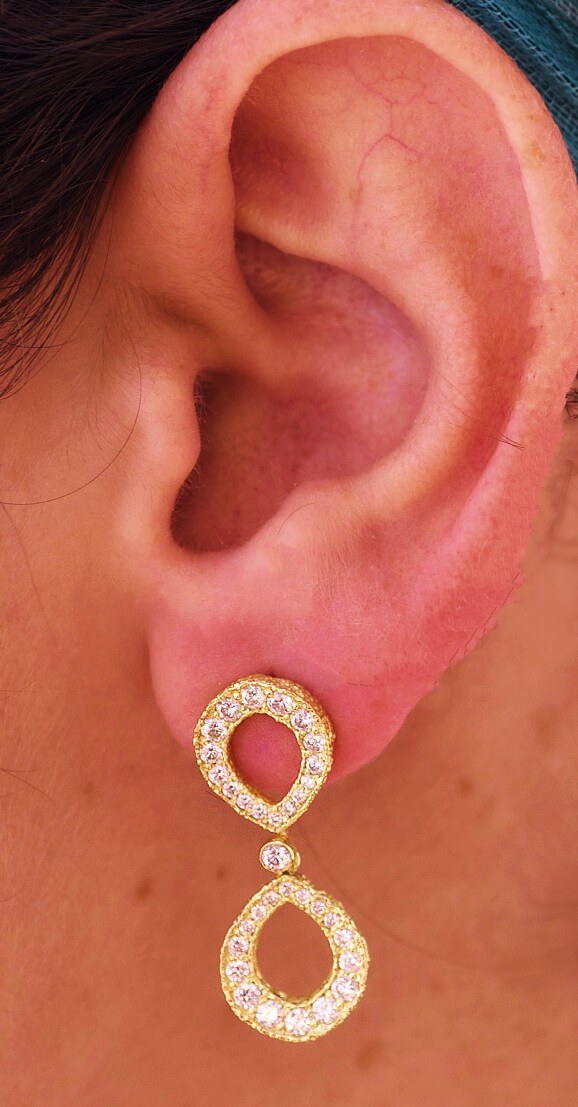 18k gold Double Infinity Diamond Earrings on model
